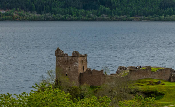 Urquhart Castle on the Loch Ness Beautifully situated remains of the Urquhart castle on the Loch Ness. It is 3km from village of Drumnadrochit and the walk from the village to castle is very scenic. drumnadrochit stock pictures, royalty-free photos & images