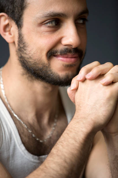 istock portrait of handsome dark-haired man smiling 697026816