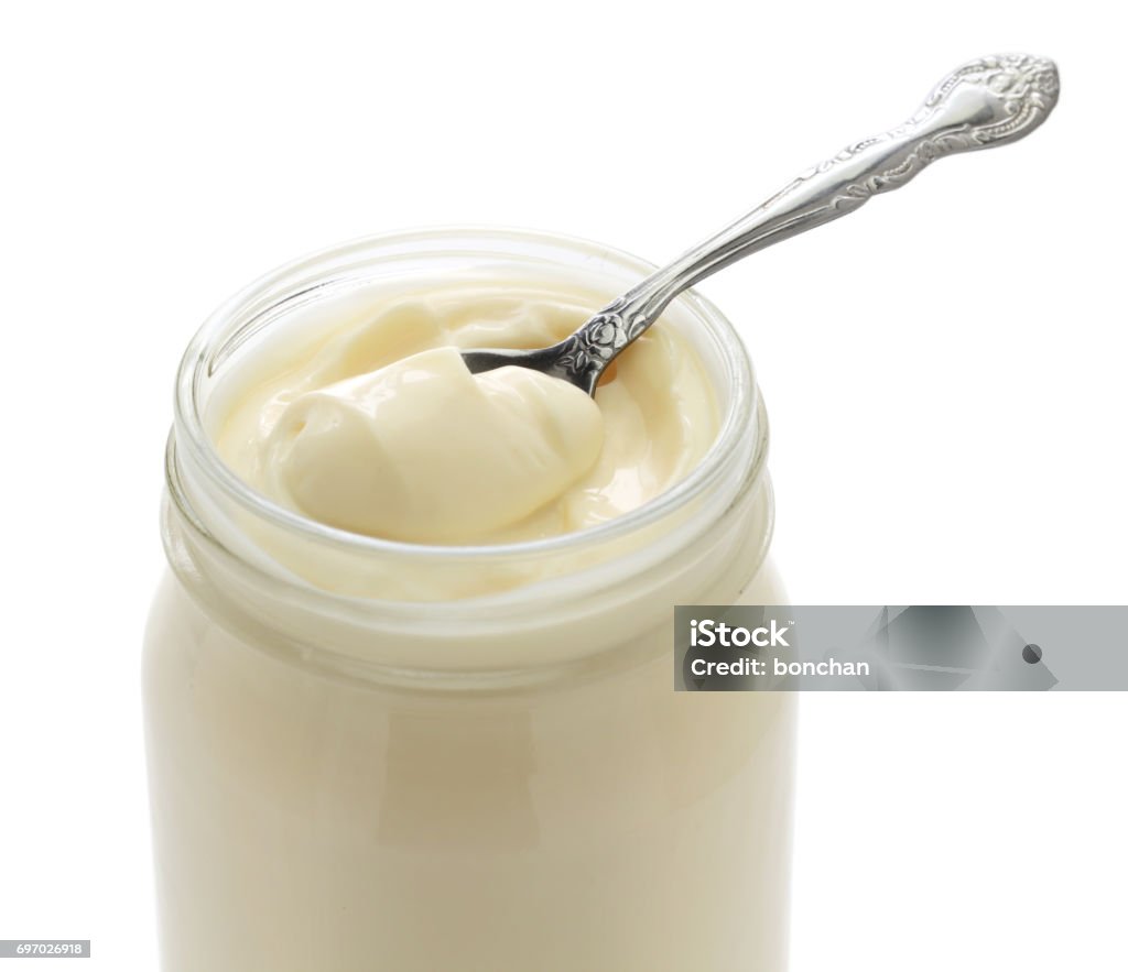 opened mayonnaise jar and spoon opened mayonnaise jar and spoon isolated on white background Mayonnaise Stock Photo