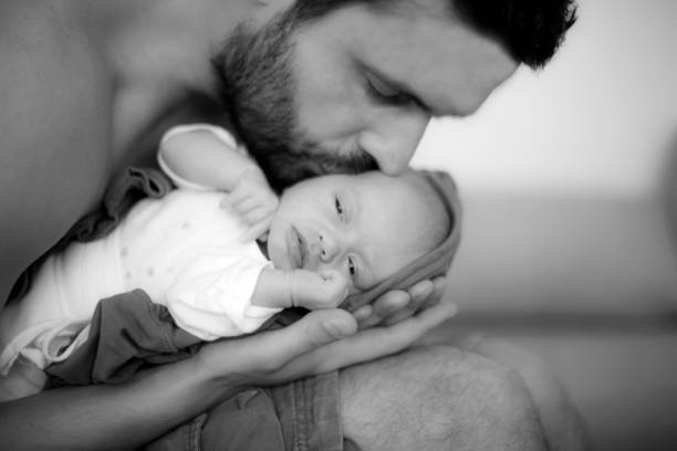 istock Newborn baby in father's arms 697026990