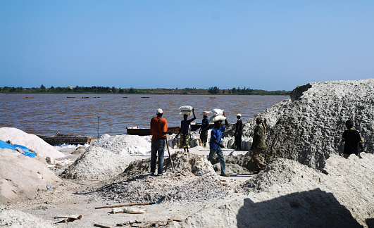 ILAKAKA, MADAGASCAR - NOV 3, 2016: teams of workers dig and move huge quantities of sand in search of sapphires, near Ilakaka, Madagascar