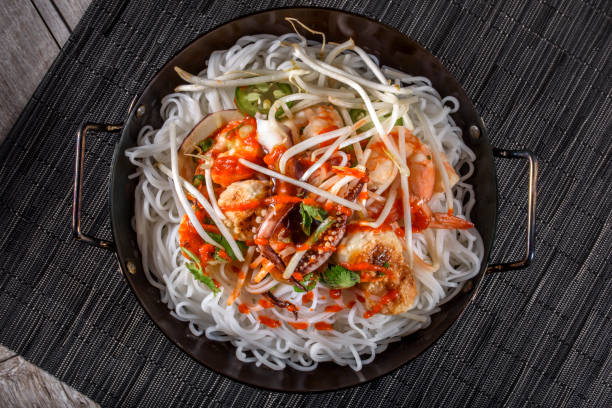 istock Delicious Asian Noodle with Bean Sprout , Mussel and Vegetables 697027330