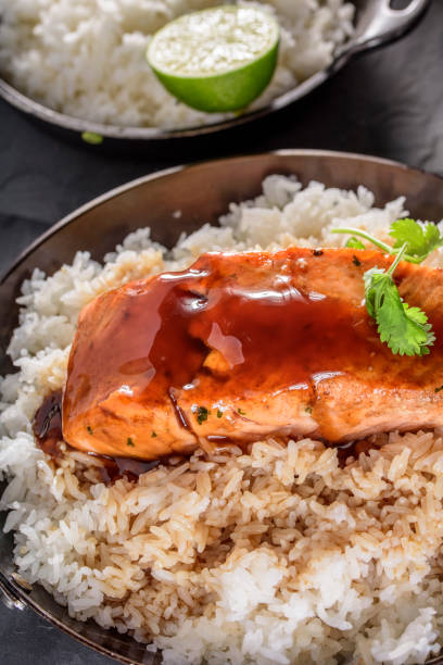 istock Pan Fried Salmon Steak with Teriyaki Sauce over Rice 697027422