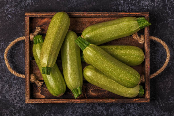 istock Fresh healthy green zucchini in box 697027588