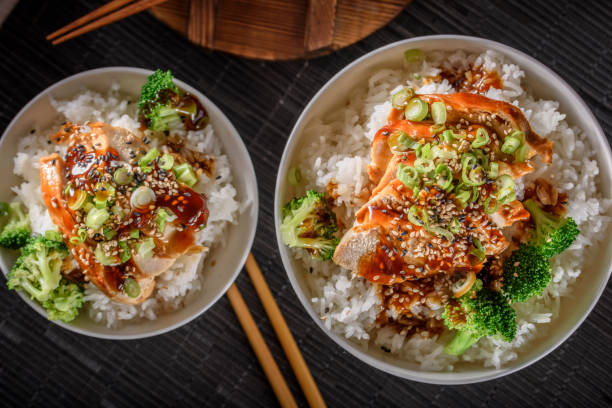 istock Grilled Chicken Breast with Teriyaki Sauce over Steamed Rice 697030372