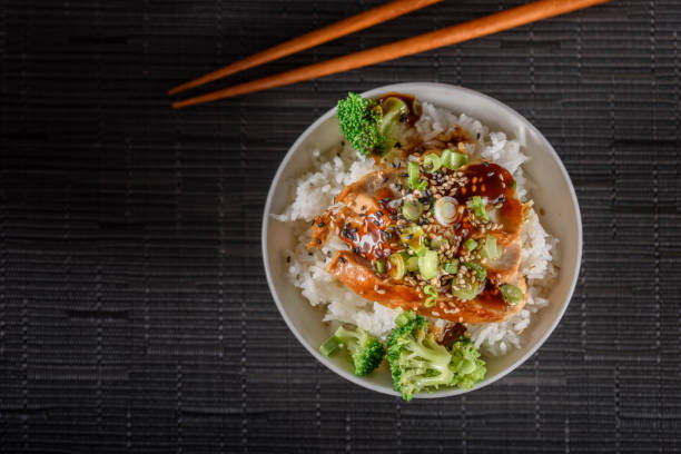istock Grilled Chicken Breast with Teriyaki Sauce over Steamed Rice 697030376