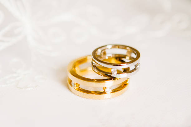istock gold wedding rings on a white background 697033850