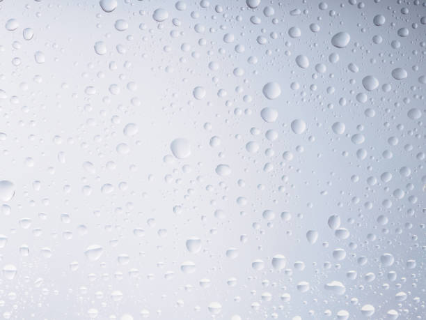 istock Water drops color background rain glass space rainbow. 697034232