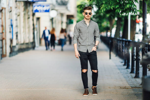 istock Fashionable man walk outdoors with white background street 697041336