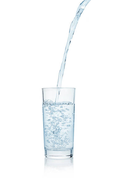 istock Water splashing from glass. 697047760