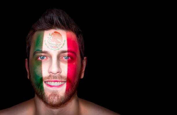 istock Fan / Sport Player painted his face with Mexican flag 697050176