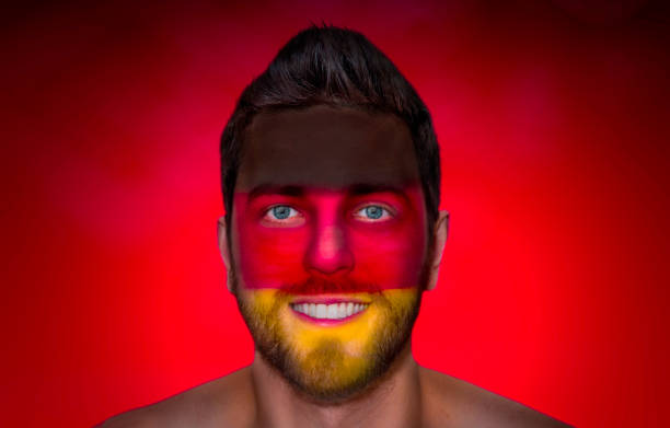 istock Fan / Sport Player painted his face with German flag 697050188