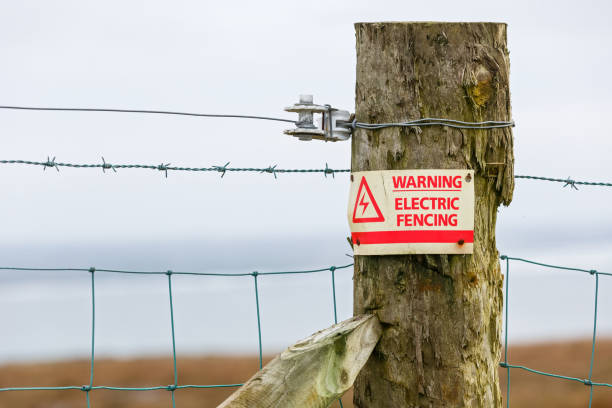 istock Electric fence danger warning sign 697050574