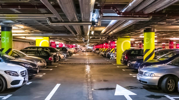 istock Modern, organized underground car parking garage. Perspective view 697051434