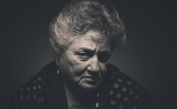 istock Senior lady low light portrait 697053982