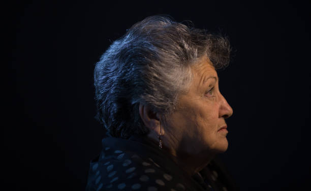 istock Senior lady low light portrait 697054010