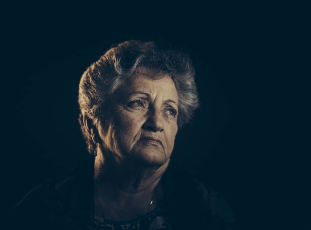 istock Senior lady low light portrait 697054026