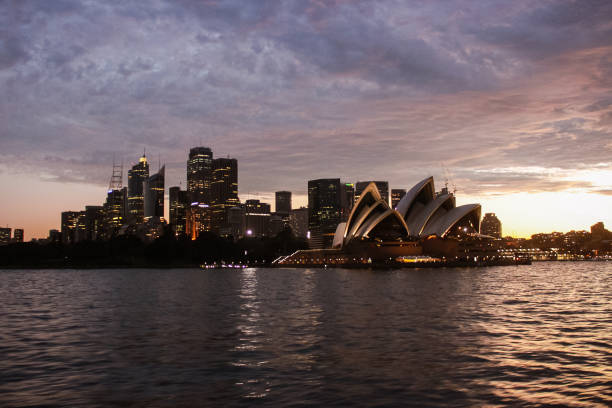 Sydney, Australia - 6th July, 2024: Sydney Opera House seen across Circular Quay, with a water level marker in the foreground.