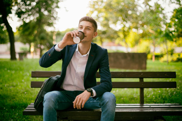 istock Sitting in a park, drink coffee 697057992