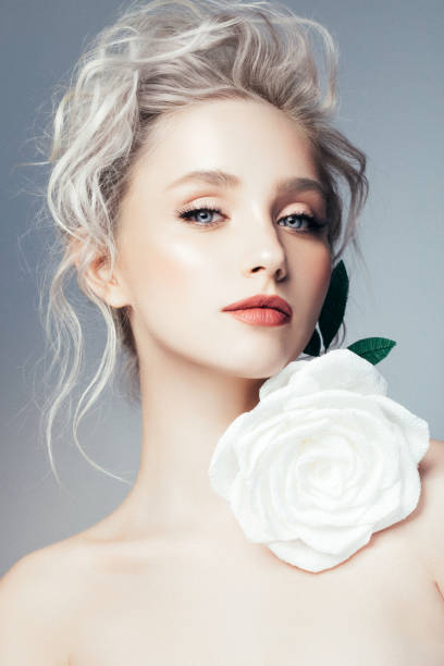 istock Beautiful woman with flower 697058214