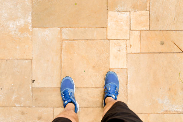 istock POV of runner shoes 697058224