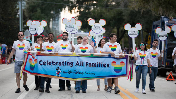 pride orlando parade some people enjoying Gay Pride Parade in Orlando and representing disney pulse orlando night club & ultra lounge stock pictures, royalty-free photos & images