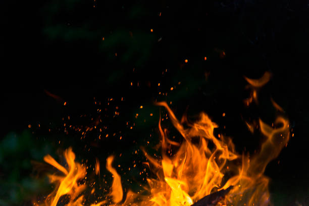 Burning fire flame on black background stock photo