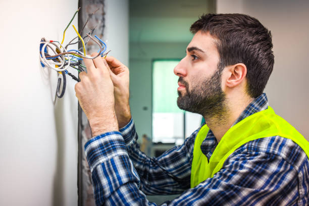 istock Electrician connecting wires 697067556