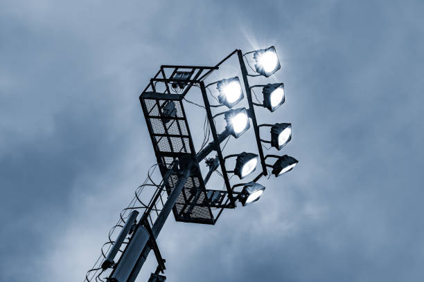 istock Stadium lights by the sports field. 697067808
