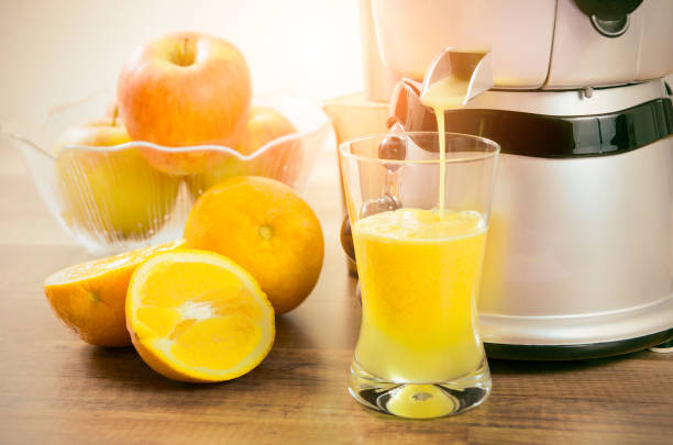 istock Juicer prepares fresh and healthy juice 697068408