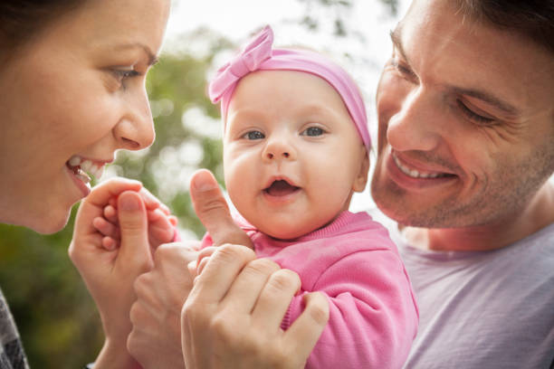istock Happy parents in park 697082578