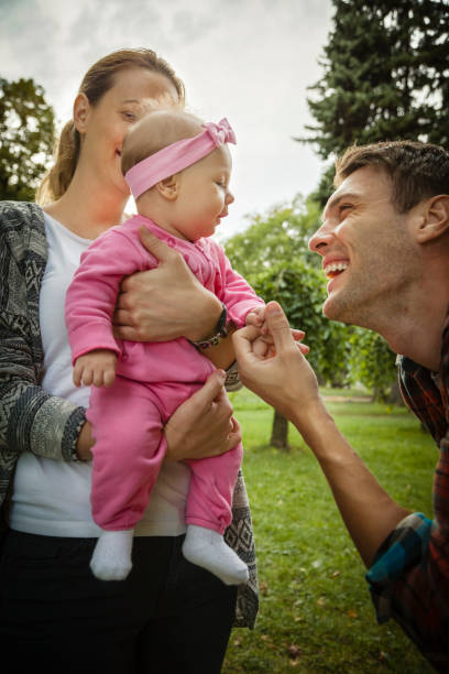 istock Happy parents in park 697083750