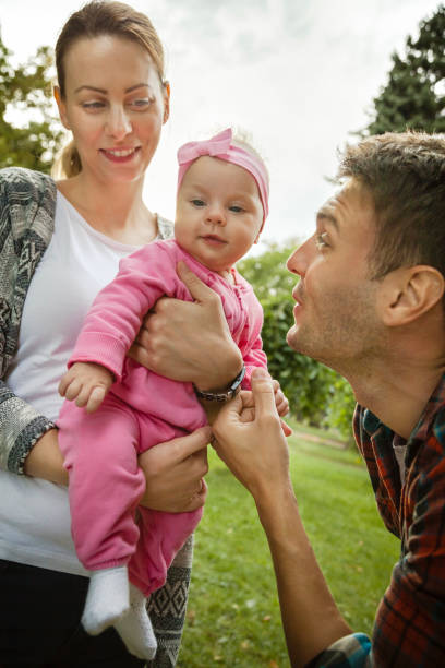 istock Happy parents in park 697085962