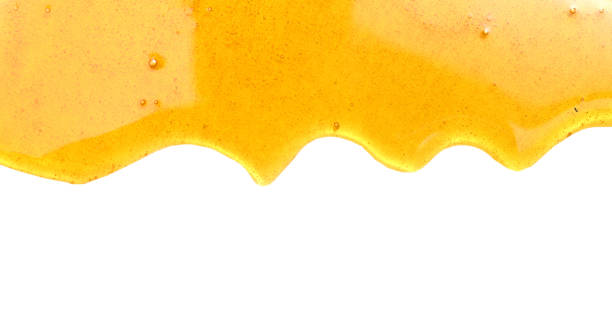 istock Sweet honey isolated on white background 697086246