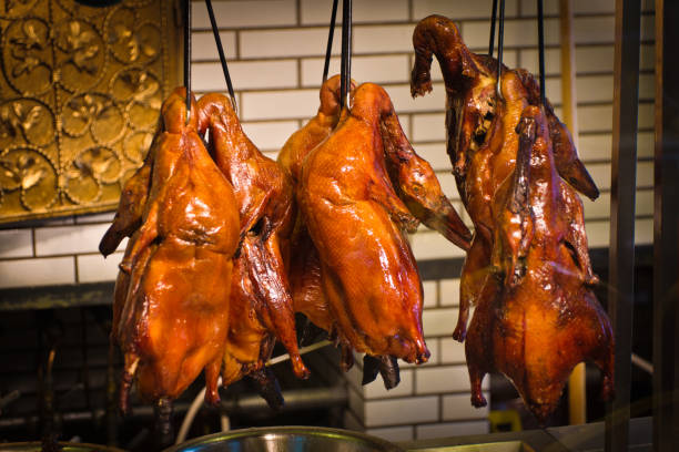 istock Roast Peking Duck Hanging on Racks in Beijing, China 697103968