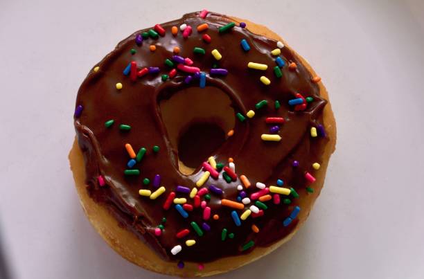 istock Chocolate Frosted Donut with Sprinkles 697119878