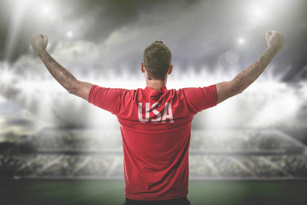 istock American Fan / Sport Player on uniform celebrating 697122262