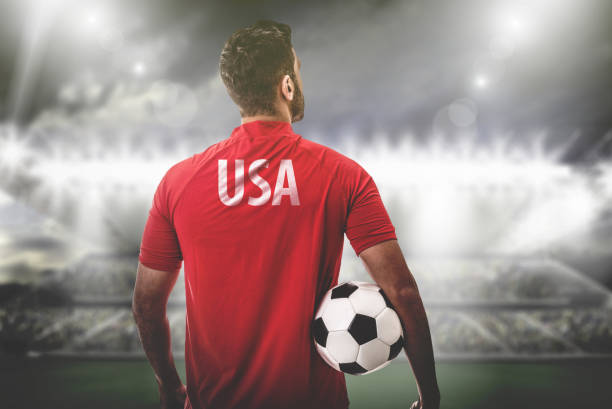 istock American Fan / Sport Player on uniform celebrating 697122290