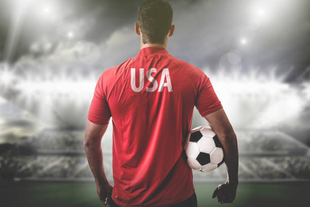 istock American Fan / Sport Player on uniform celebrating 697122298