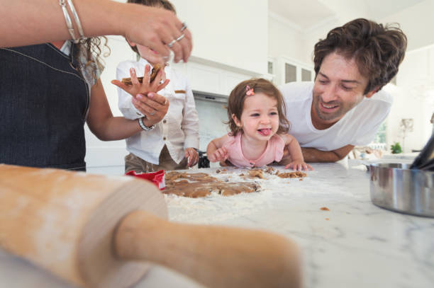 istock Family enjoying making cookies together. 697123134