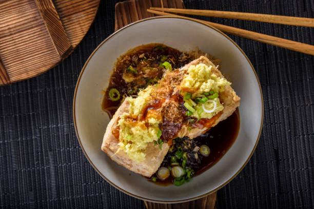 istock Agedashi, Deep Fried, Tofu with Ground Ginger , Scallion and Soy Sauce 697123316