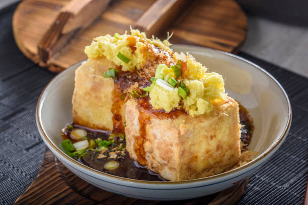 istock Agedashi, Deep Fried, Tofu with Ground Ginger , Scallion and Soy Sauce 697123392