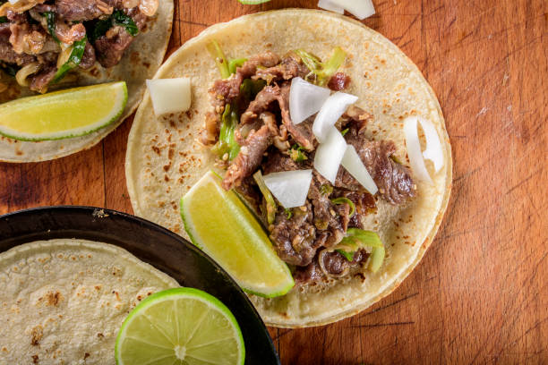 istock Bulgogi over White Corn Tortilla with Scallion and Slice of Onion 697123492