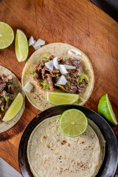 istock Bulgogi over White Corn Tortilla with Scallion and Slice of Onion 697123504