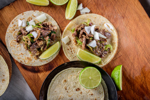 istock Bulgogi over White Corn Tortilla with Scallion and Slice of Onion 697123532
