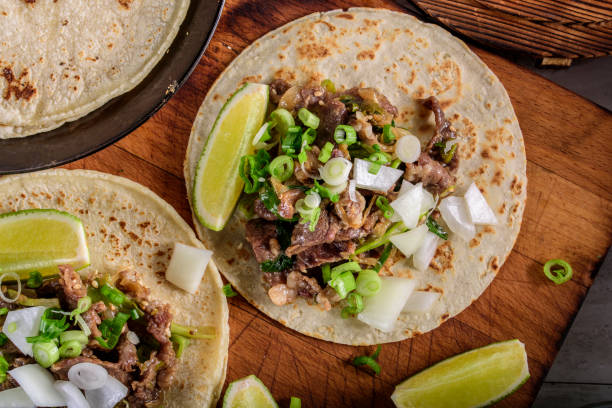 istock Bulgogi over White Corn Tortilla with Scallion and Slice of Onion 697123544