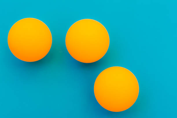istock yellow tennis ball on a blue background 697127890