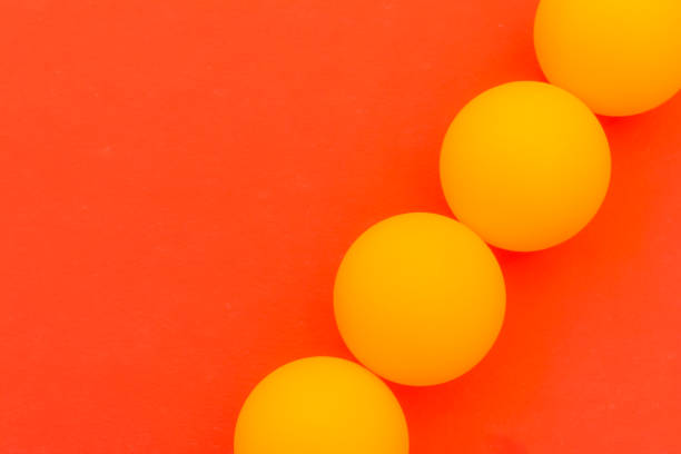 istock yellow tennis ball on a red background 697127900