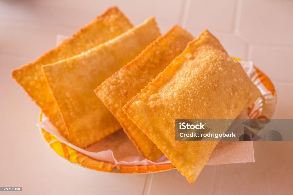 Brazilian Cheese Pastel Brazilian Cheese Pastel in a bowl over a white table Pastel - Food Stock Photo