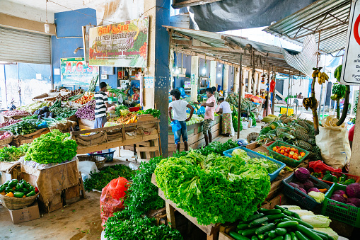 Sunday in Hikkaduwa - local food market. Vendor selling vegetables and fruits. This market is a great way to see Hikkaduwa’s local life come alive.